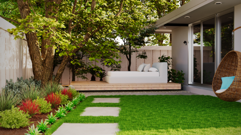 A family arranging furniture and planters on a sunny backyard patio with a grassy lawn and trees in the background.