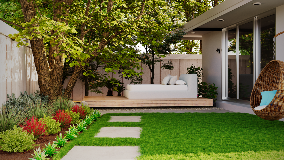 A family arranging furniture and planters on a sunny backyard patio with a grassy lawn and trees in the background.